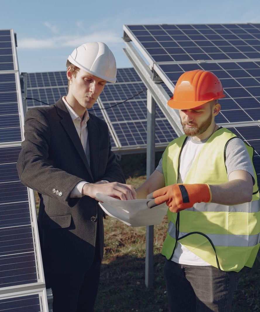 Engineers reviewing documentation at a solar installation